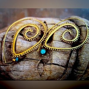 Beautiful tribal style spiral earrings with turquoise stone